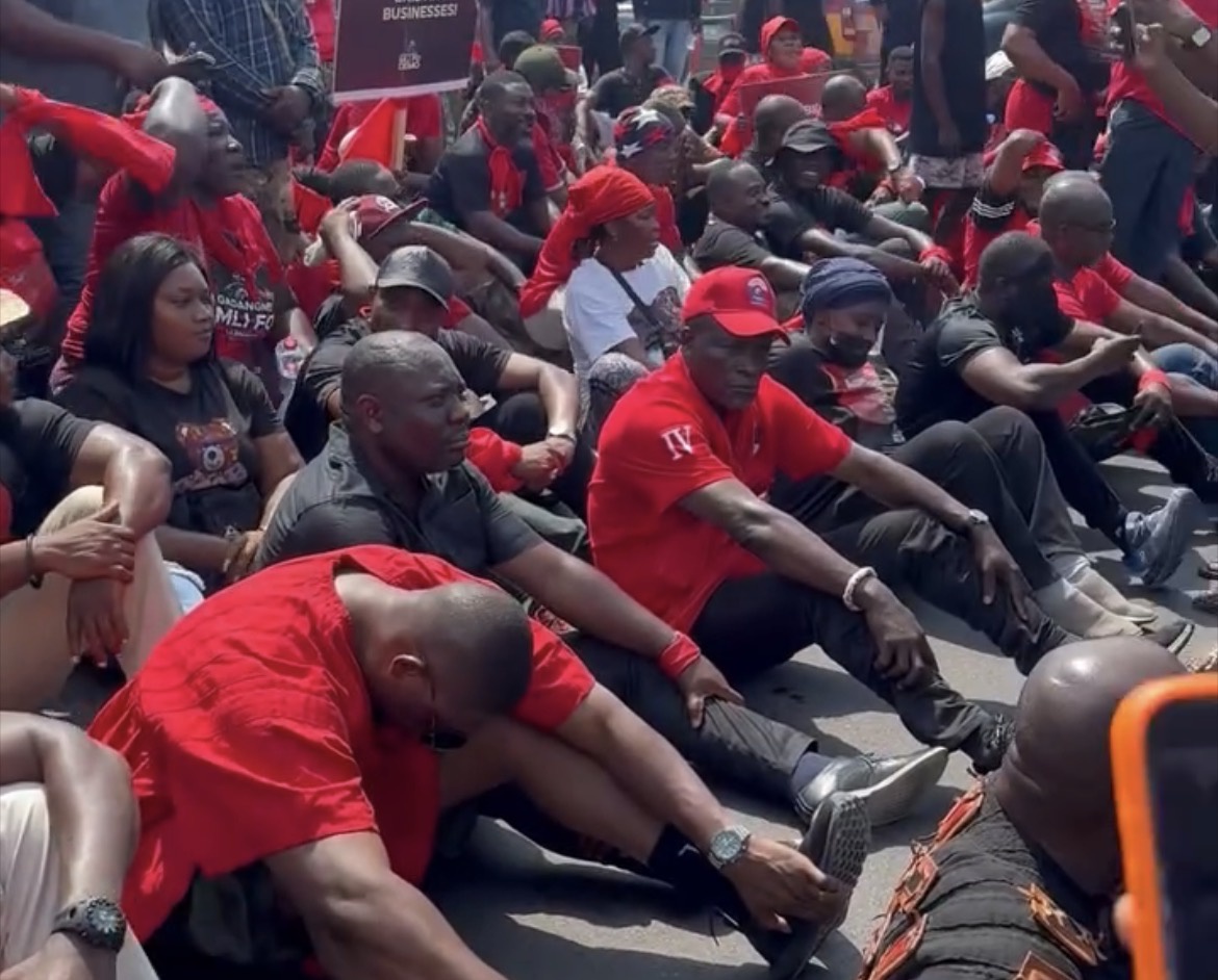 Protesters Seen Sitting On The Floor In The Streets As They Express Their Frustration With The NDC