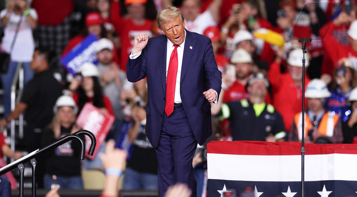 Donald Trump dances on stage after speaking at a campaign rally. (Charly Triballeau/AFP / Getty Images)