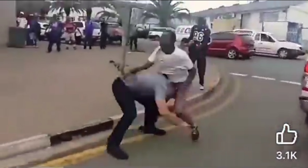 White man overpowers two black men in filmed confrontation