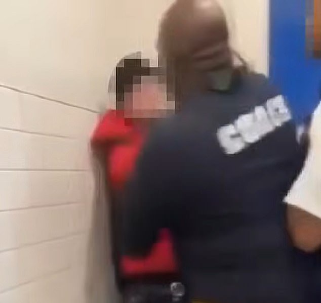 Disturbing video shows school coach pin cursing boy to wall after fight erupted over bathroom