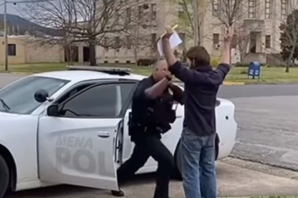 Shocking moment officer violently attacks father with his hands raised searching for his young son