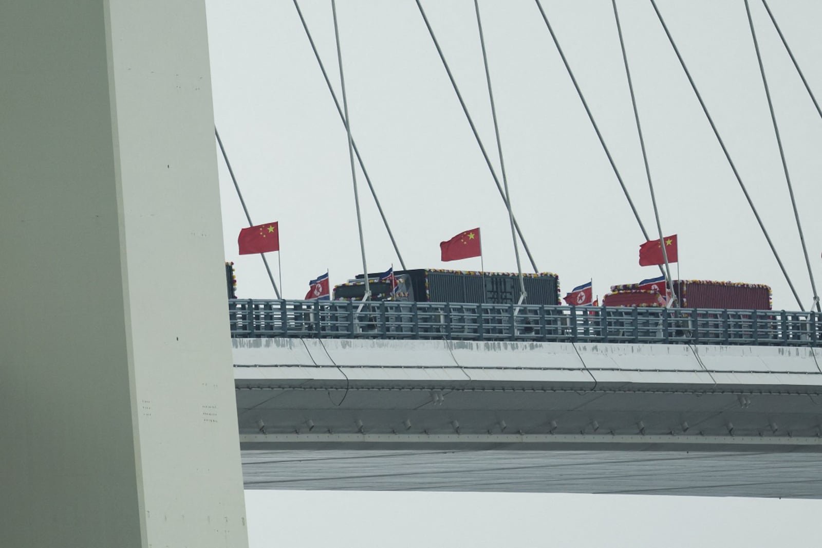 Trucks line up as long-delayed China-North Korea bridge opens