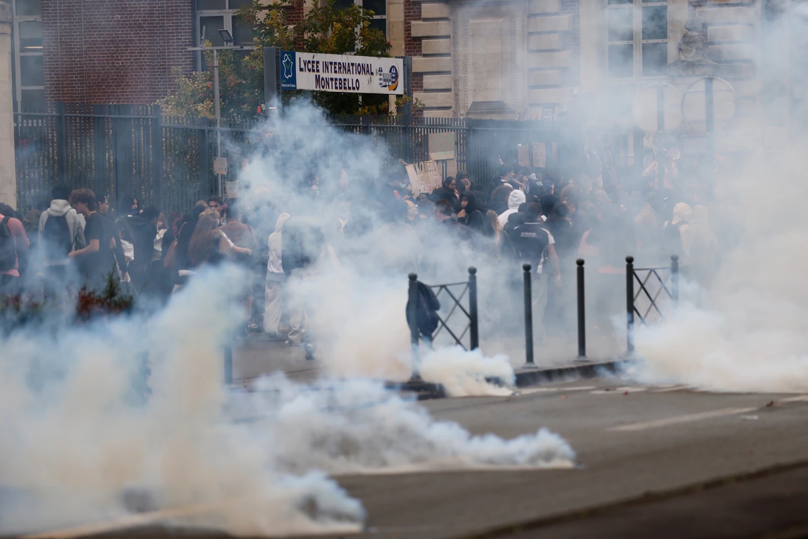Police fire teargas at French protesters on biggest day of school demonstrations