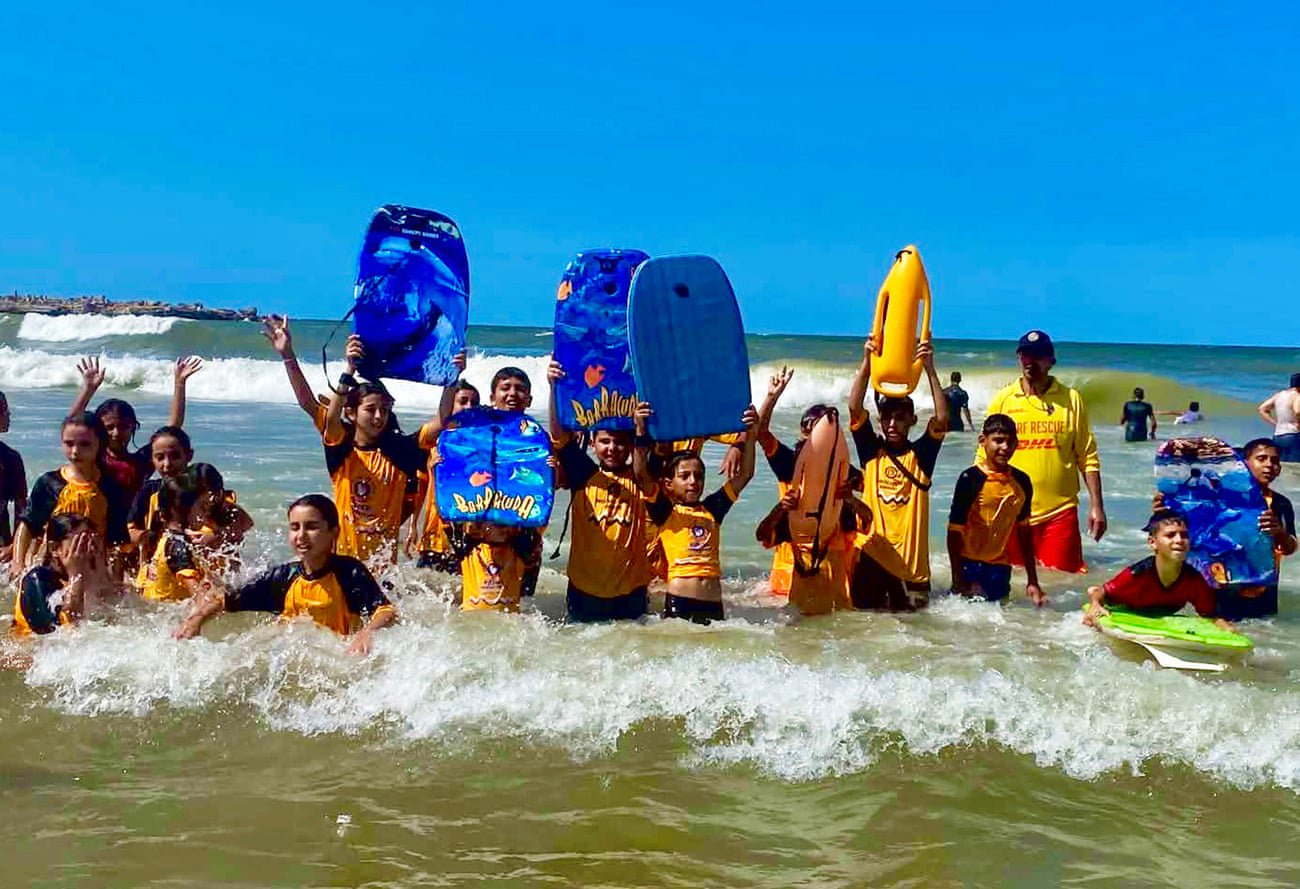 Out of the rubble and on to the beach: Gaza’s junior surf lifesavers return to the waves after three years of war