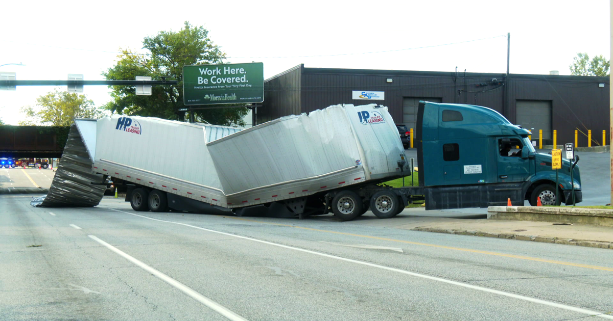 Semi-Truck Carrying Busch Light Strikes Low Bridge in Erie