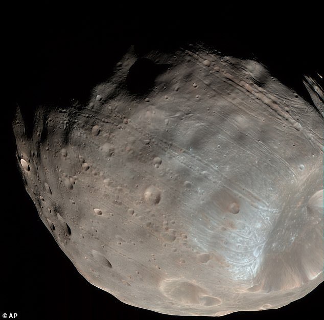 Mission to Mars! Japanese spacecraft to begin epic five-year quest to bring Martian moon samples back to Earth for the first time