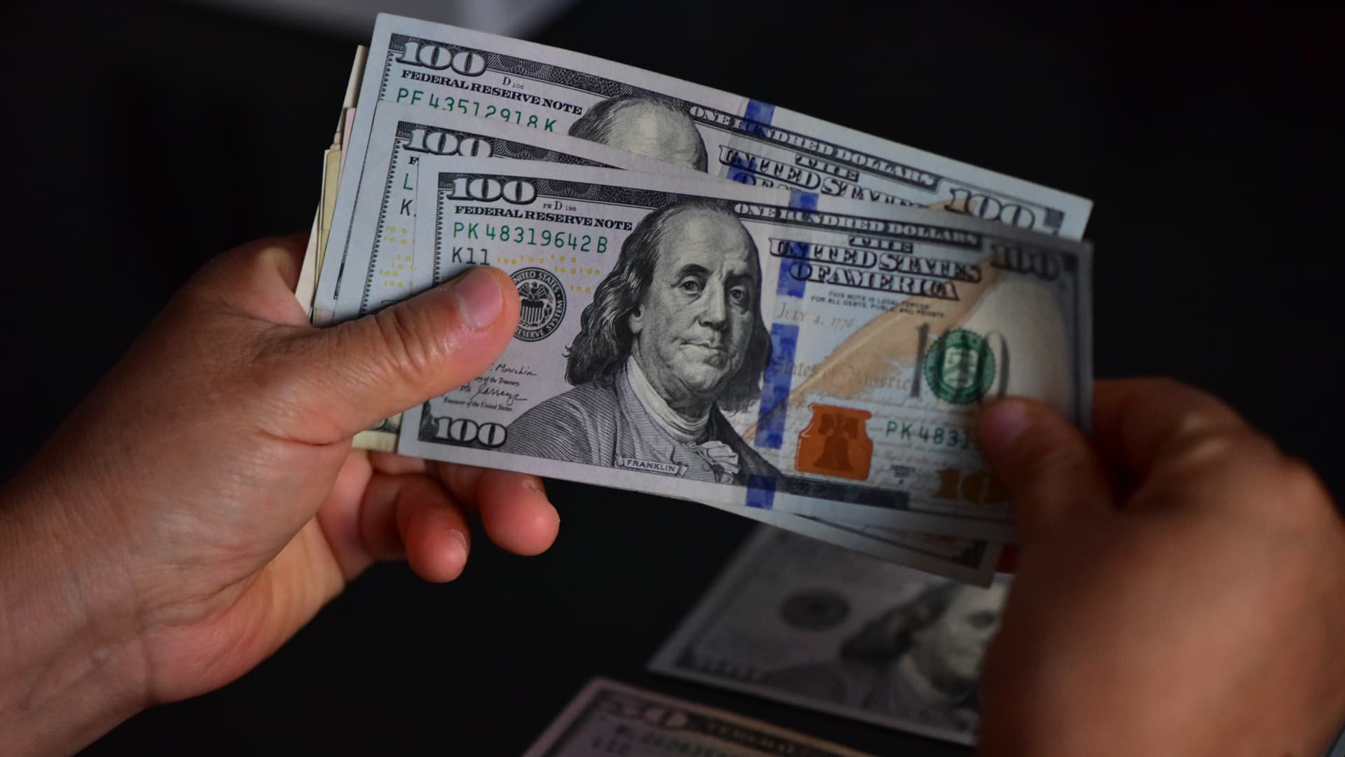 Dollar edges back from 18-month high after FOMC minutes