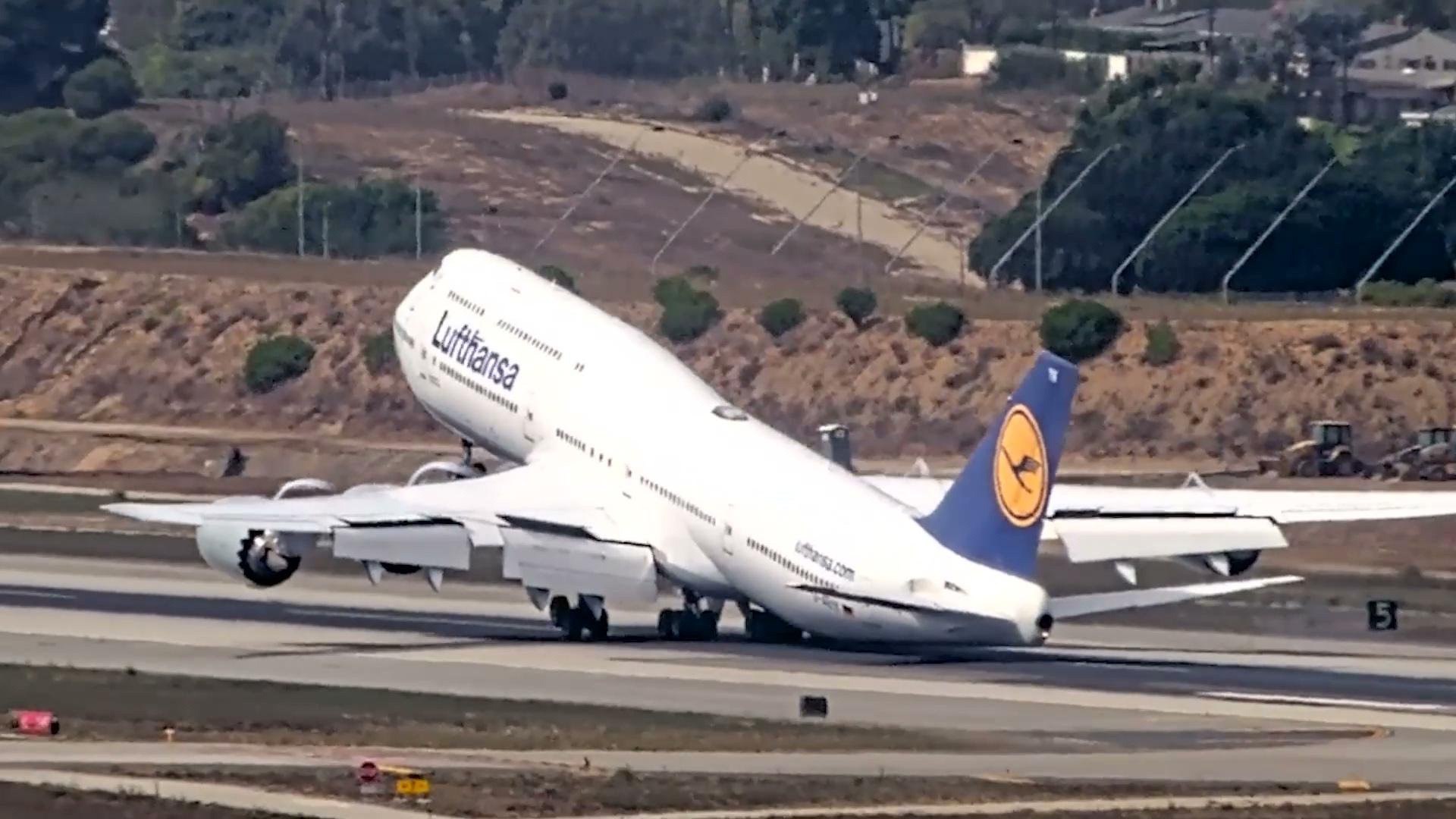 Terrifying moment massive Boeing 747 bounces off runway at LAX as tail scrapes ground