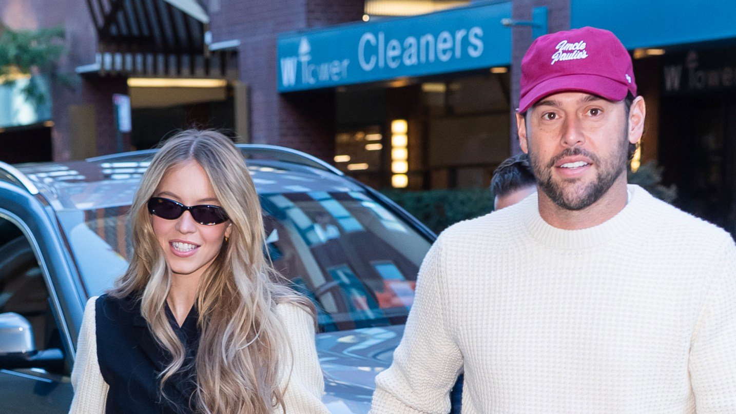 Sydney Sweeney shows off her long legs in tiny miniskirt as she holds hands with boyfriend Scooter Braun in NYC