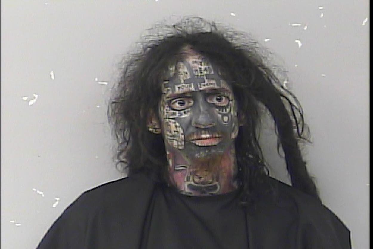 Bizarre mugshot shows ‘demonologist’ accused of tracking women by their phones