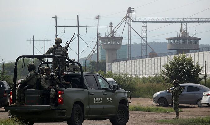 Toddler dies and dad injured in prison brawl as inmates open fire during visiting hours