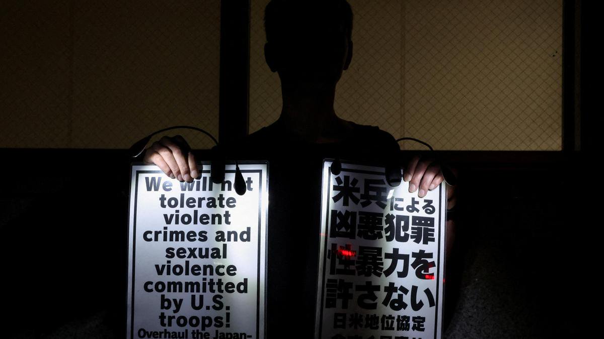 U.S. military restricts troops from leaving the base in Okinawa after Marine is arrested in a killing