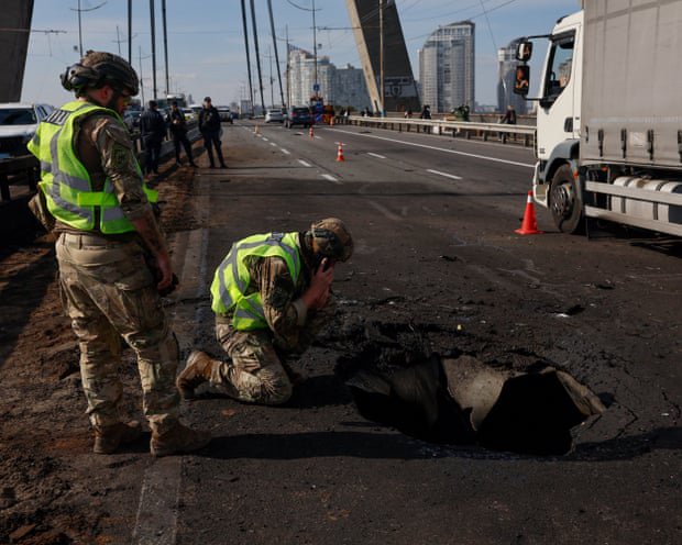Russia strikes Kyiv bridge as German chancellor visits Ukraine in show of support