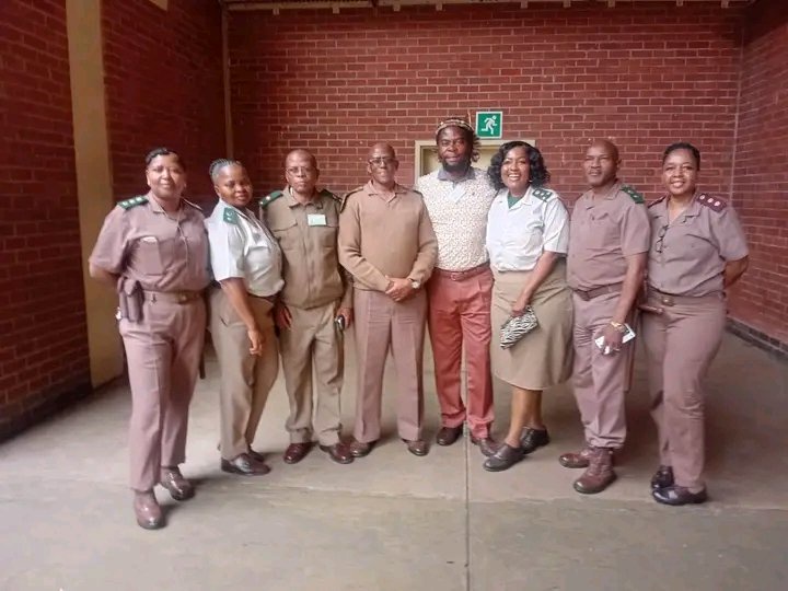 Phakelumthakathi seen with prison officials and inmates at Westville