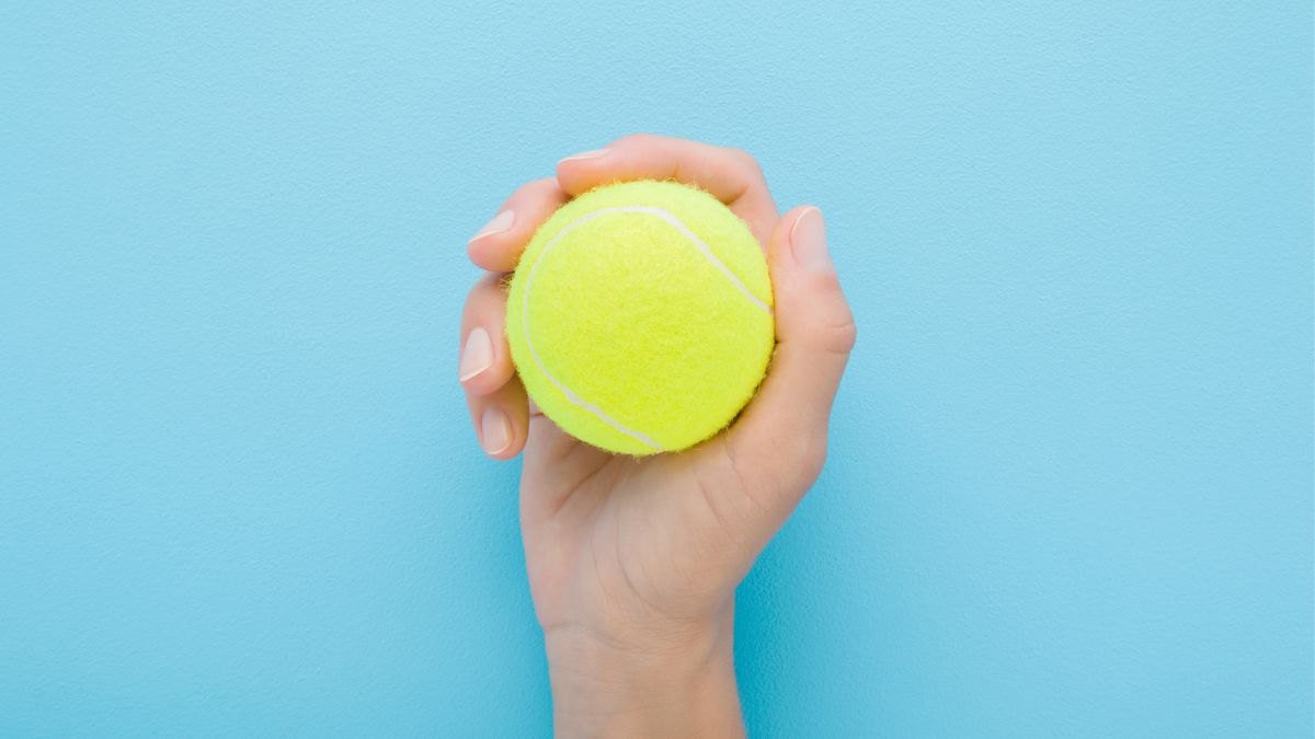 This Five-Minute Tennis Ball Trick Cuts Lower Back Pain by 55 Percent