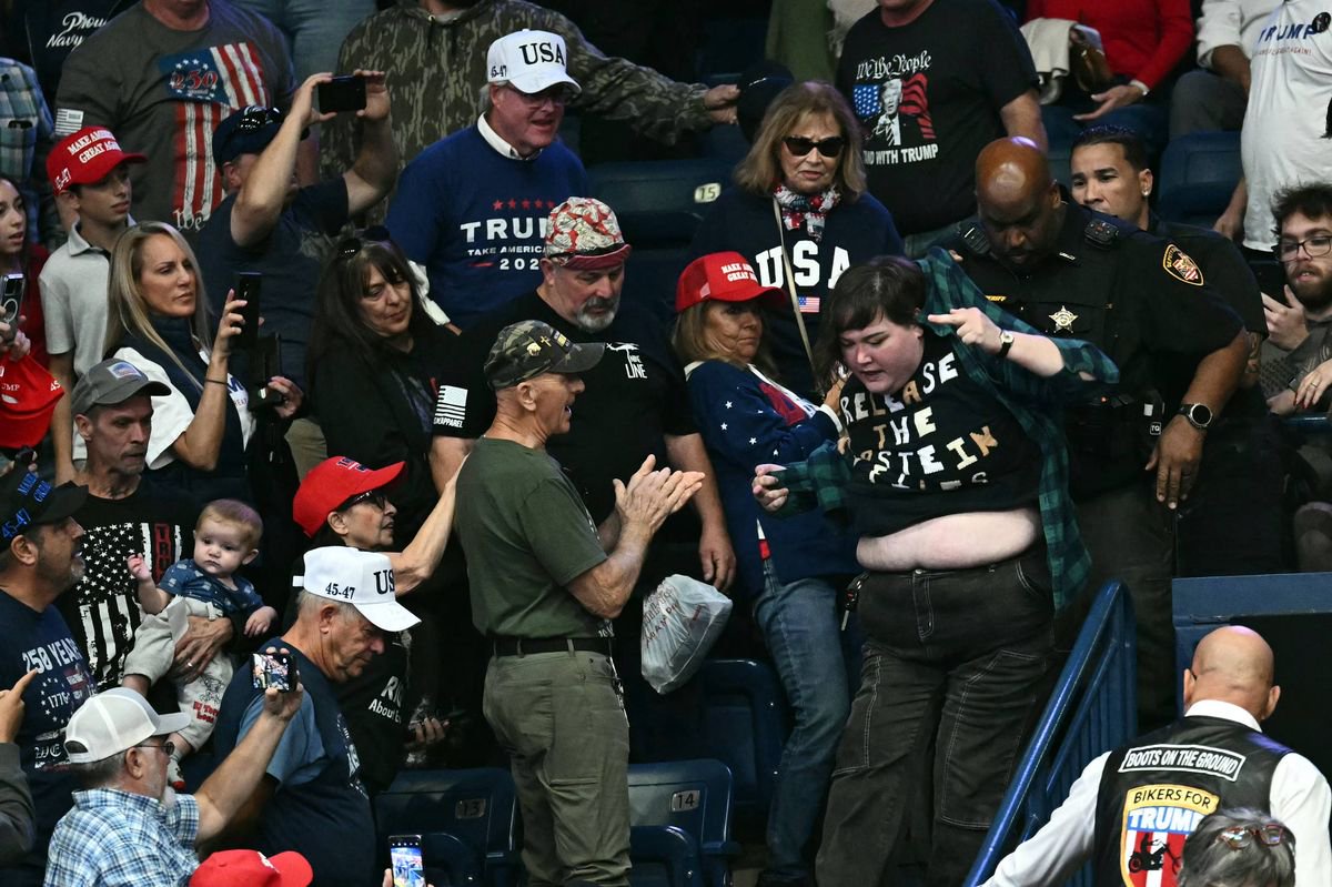 Female Trump protester punched in the face by a man while president calls her ‘fat guy’