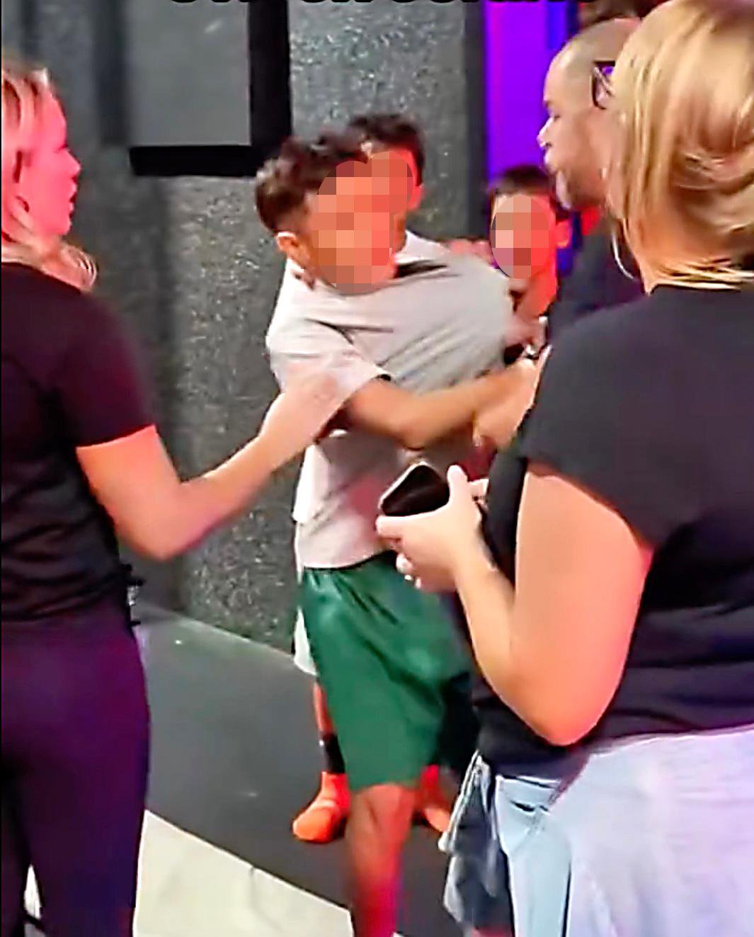 Shocking moment thug throttles young boy at California trampoline park