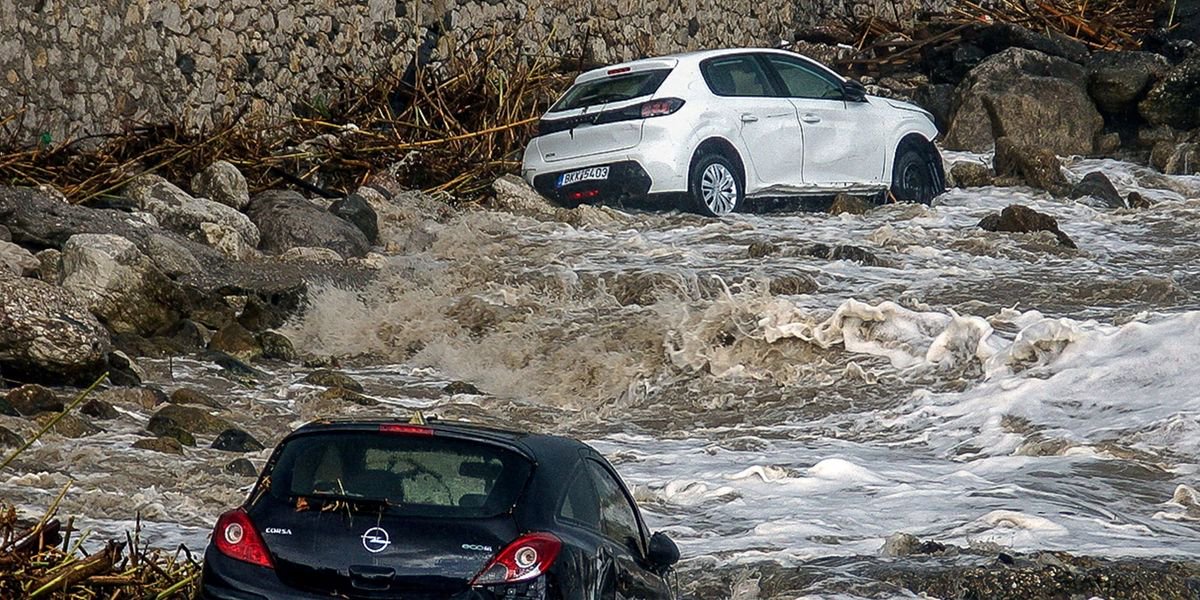 Man dies as flash floods batter popular tourist island and force state of emergency
