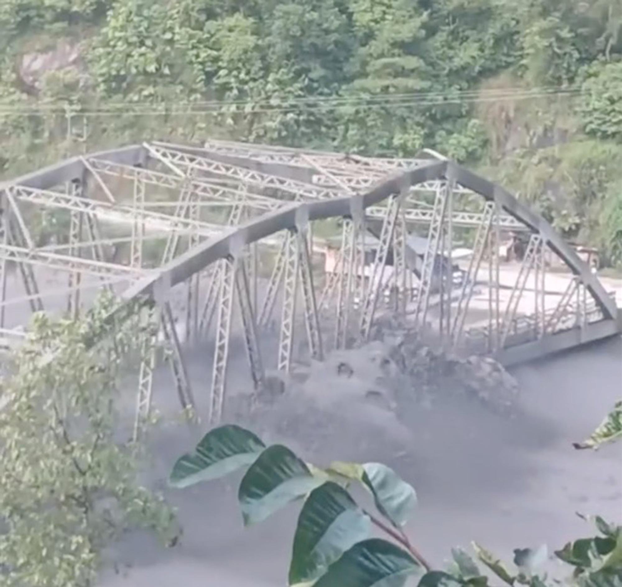 Roaring flash floods wipe out entire bridge in Nepal in dramatic video