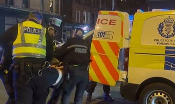 Balaclava-clad anti-migrant protesters chant ‘we’ve had enough’ as they clash with police