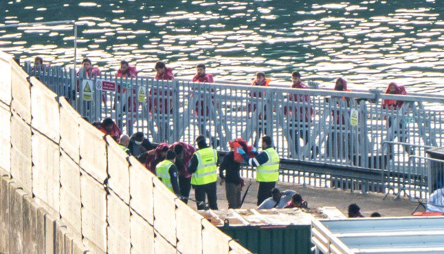 ‘Patriots’ block ambulances at anti-migrant protest as boat carrying 120 prepares to land in UK