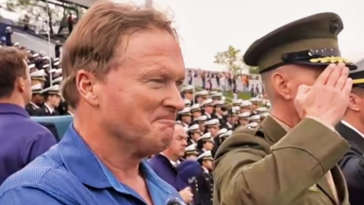Jon Gruden Gets Himself Into An “Absolute Pretzel” During National Anthem At Navy Game [VIDEO]