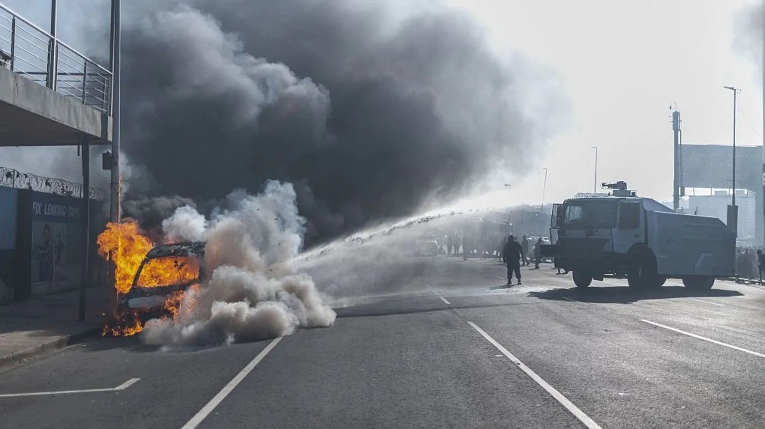 Cars torched and shops looted as anti-migrant violence erupts in South Africa