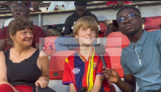 Danish Young Football Fan Enjoys Hearts of Oak Atmosphere at Ghana Premier League Match