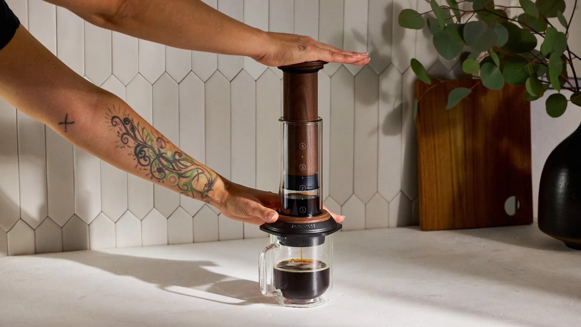 AeroPress has given its iconic coffee maker a stunning walnut redesign — and paired it with a matching wood-clad version of my favorite manual grinder