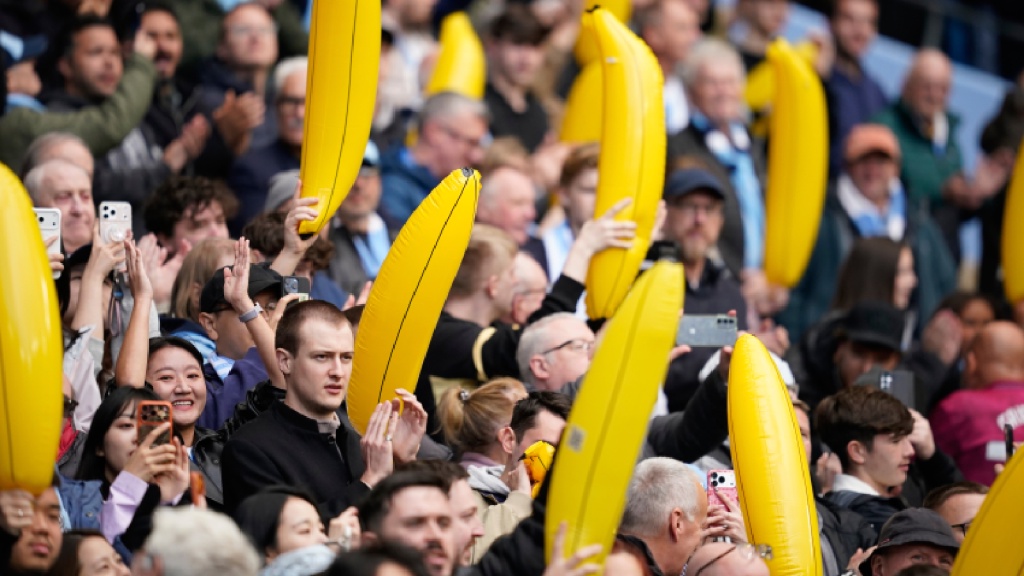 Why are Manchester City fans bringing yellow, inflatable bananas to matches?