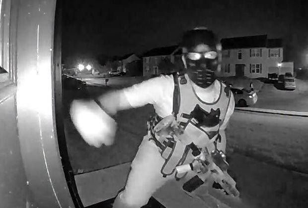 Photos show person with apparent rifle knocking on doors in Delaware neighborhood, police say