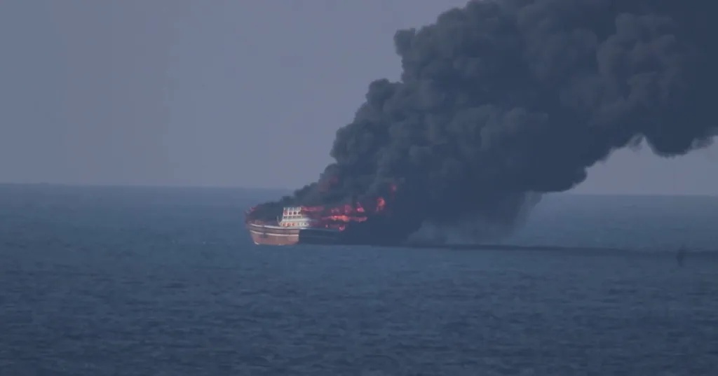Moment US helicopters blow up Iranian spy boat in huge blaze after sea mine sinks container ship carrying iPhones