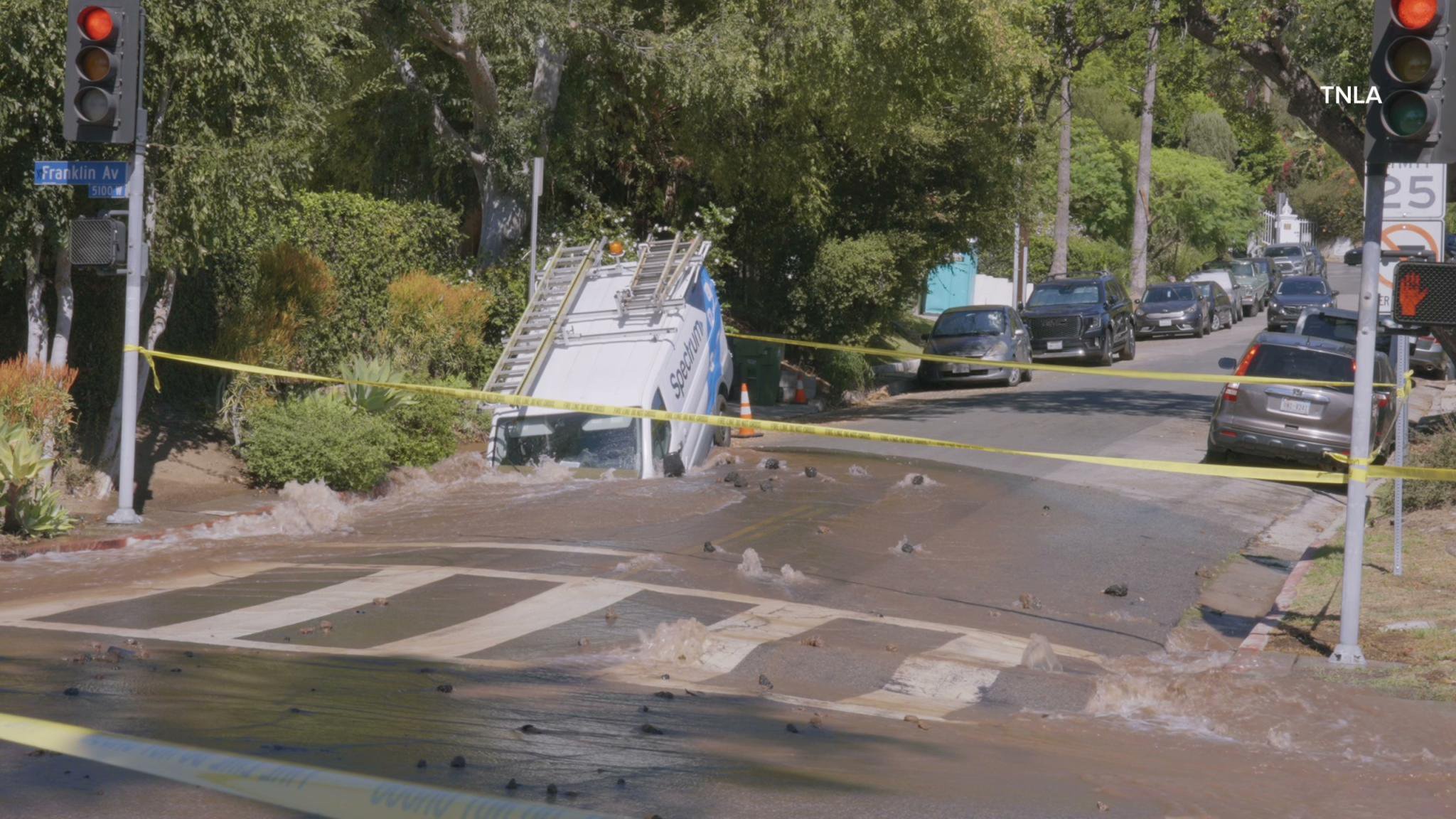 Massive sinkhole opens up on busy Los Angeles street swallowing entire van