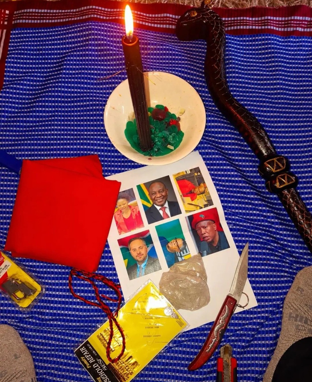 Photos of Cyril Ramaphosa and Julius Malema appear in a traditional ritual setup