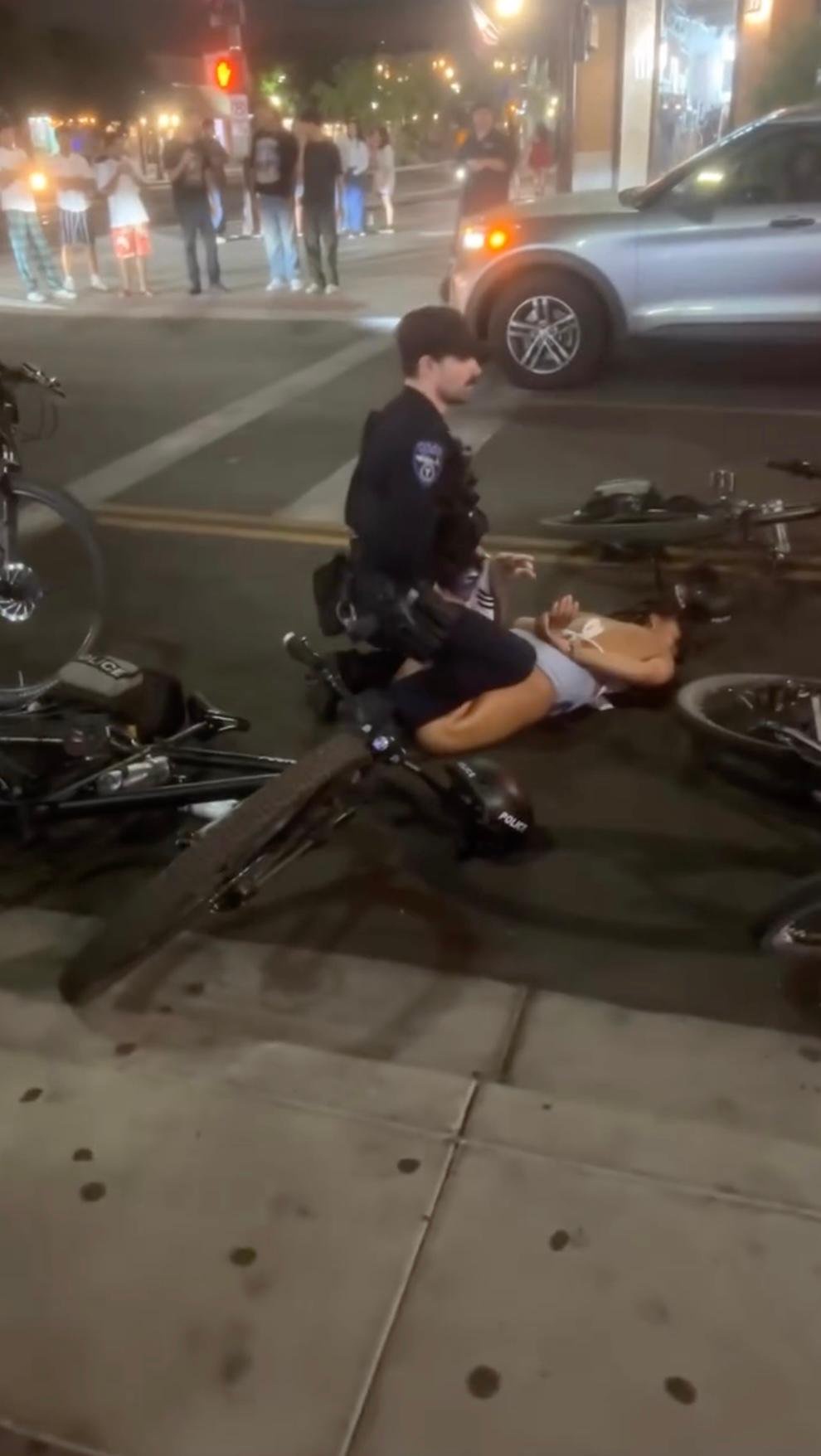 Viral video captures Arizona State University cheerleader being shoved to ground, pummeled by cops
