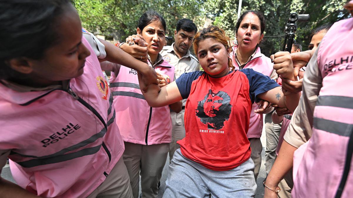 Women police personnel lead crowd control efforts during protest