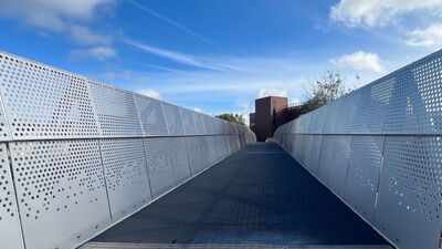 UK engineers started with previously unwanted steel instead of a bridge design; they built the Tan House Footbridge around the available material to cut embodied carbon