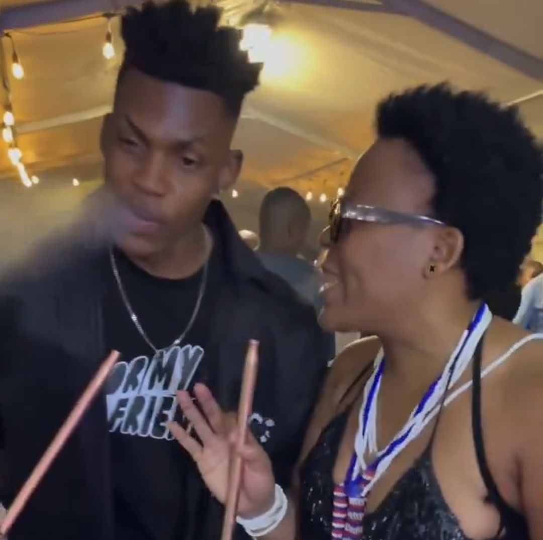 Zodwa Wabantu seen with a younger man sharing a hookah at a crowded event