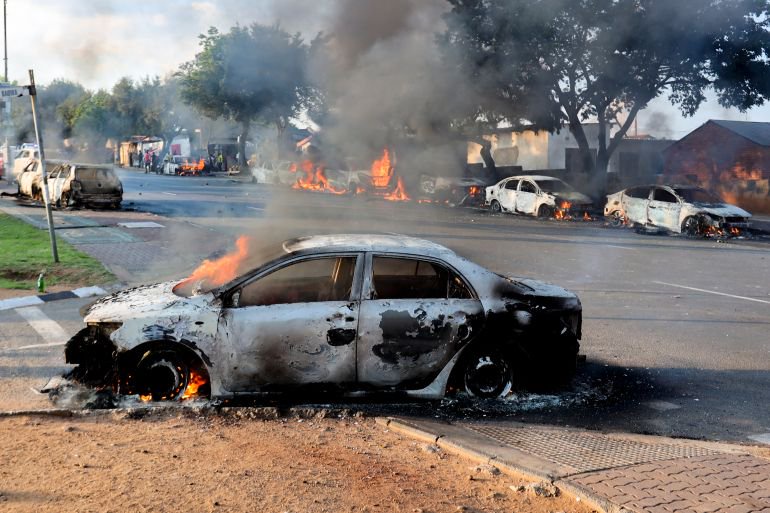 Cars torched and shops looted as anti-migrant violence erupts in South Africa