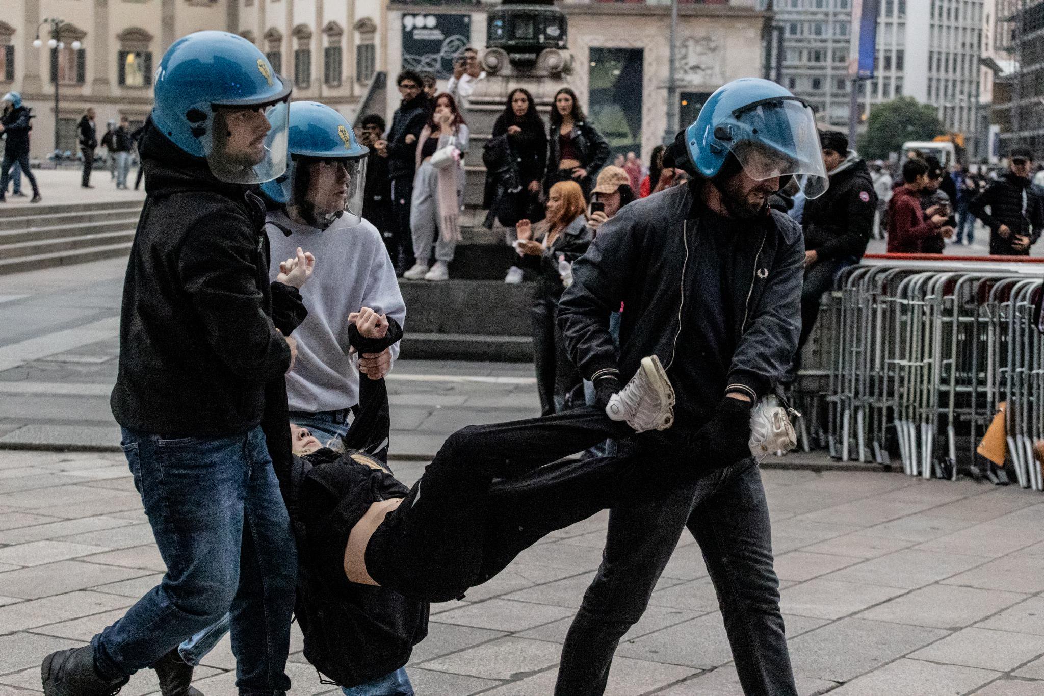 Italian police arrest hundreds of protesters over tense clashes, looting businesses