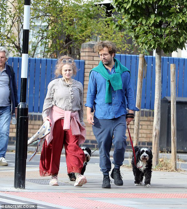 Helena Bonham Carter, 60, and her ‘old-soul’ lover Rye Dag Holmboe, 38, walk their dogs as they enjoy a romantic stroll