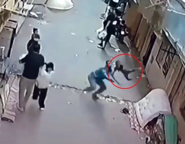Heart-stopping moment child plunges from balcony after getting tangled in washing line as hero neighbour catches boy