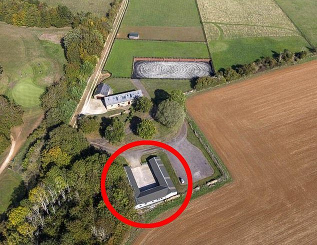 Businessman secretly living inside a ‘granny flat’ hidden inside a horse stable on his £2.25million Cotswolds estate for nearly TEN YEARS must tear it down
