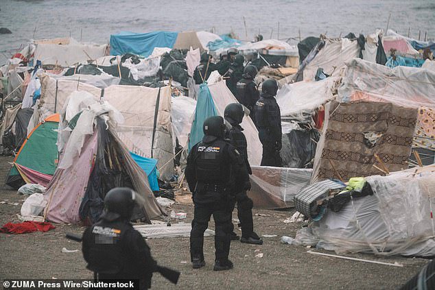 Spanish police clear Ceuta beach where 3,000 migrants had set up camp ahead of visit by royal family