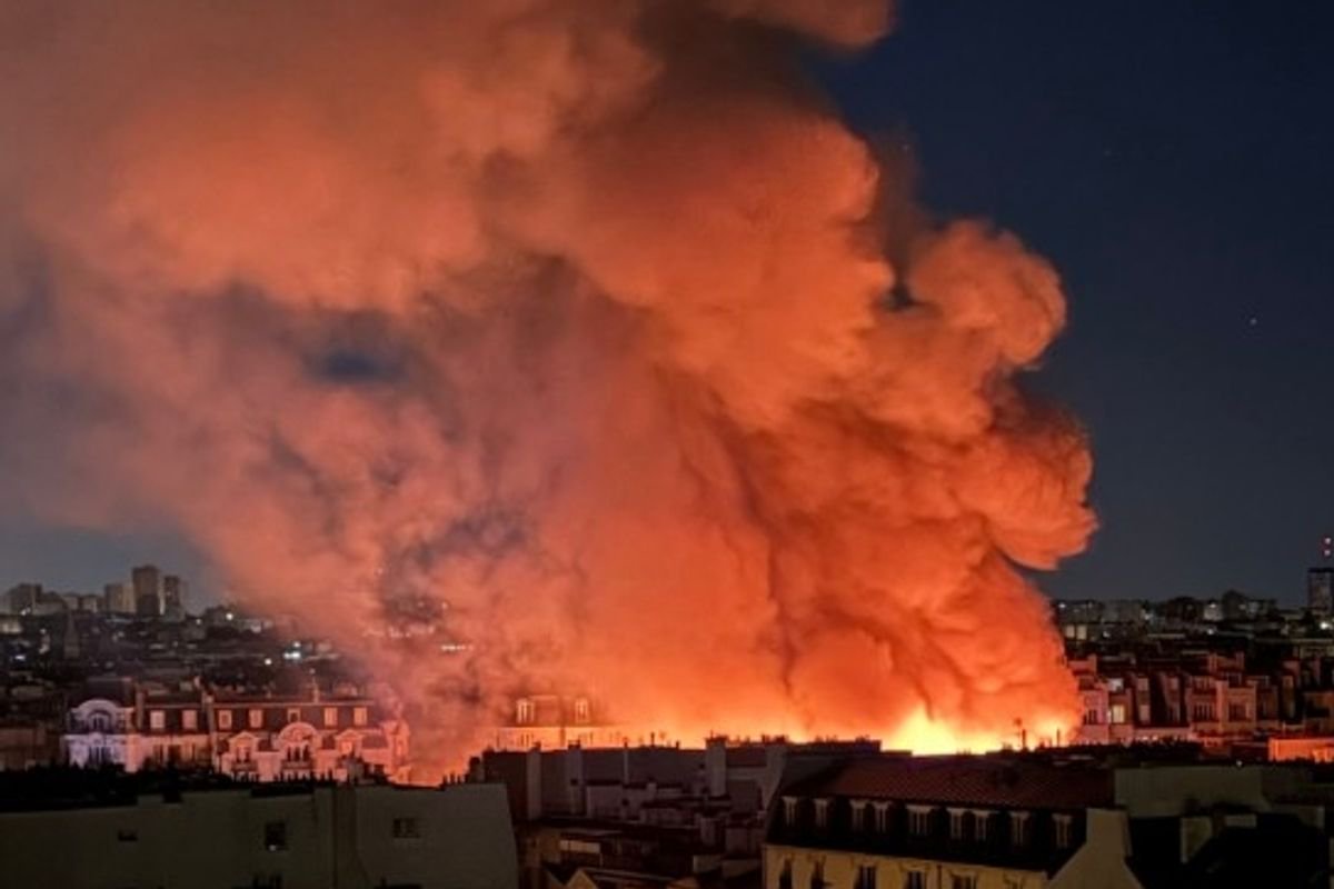 Fire ravages Paris tourist attraction with flames seen from miles away as emergency crews swarm