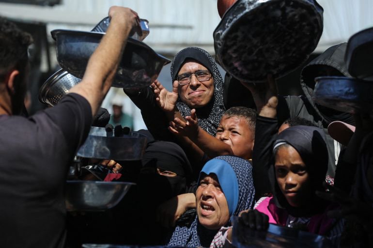 Photos: Gaza mothers endure endless lines as famine fears persist