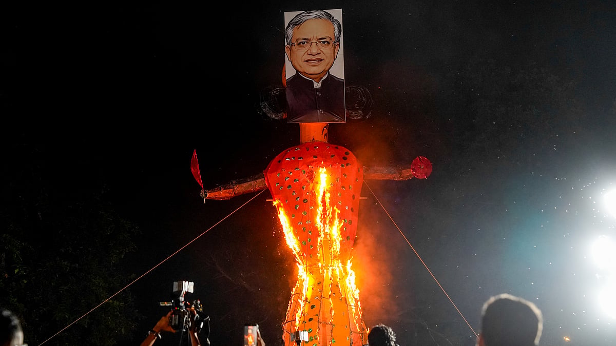 IYC burns effigy of CEC; BJP protests against Cong silence on JNU professor