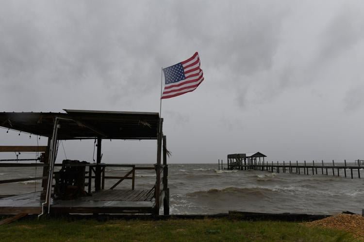 Isaias weakens but flash flooding threat persist as hundred of thousands grapple with power outages