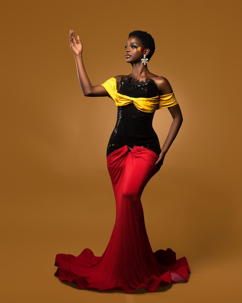 Kimberly Jael’s Black, Yellow & Red Gown Is Her Fashion Tribute to Uganda’s Independence Day