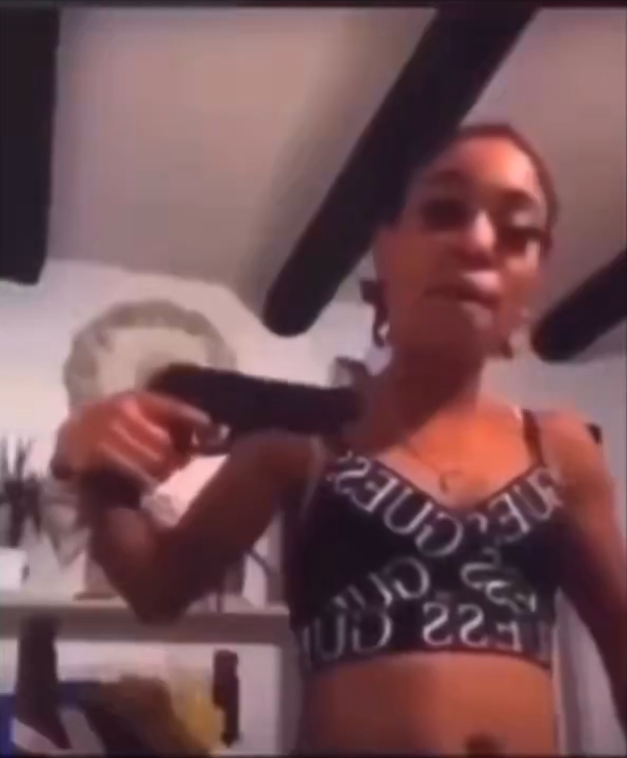 Woman waves what looks like a gun and then says she will remove the battery